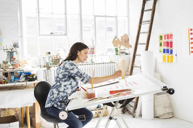 Female artist working in studio
