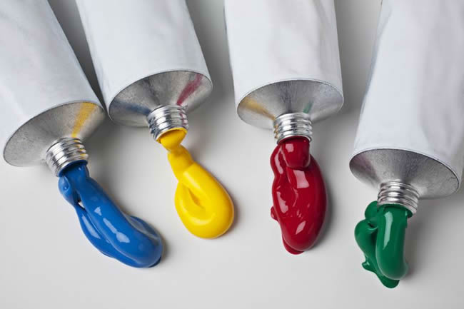 Acrylic Paint being squeezed from tubes