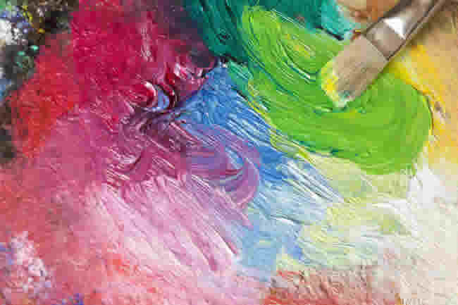 Paintbrush with oil paint on a classical palette