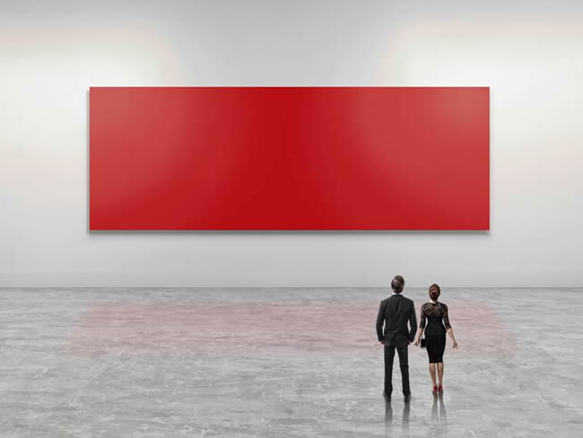 Business people looking at giant red art canvas
