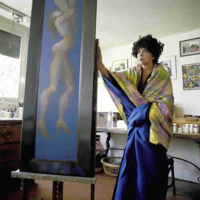 Leonor Fini with one of her paintings