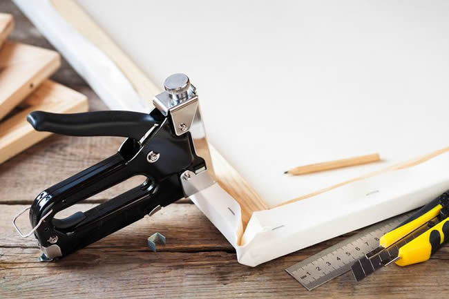 staple gun on canvas stretcher