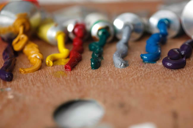 Tubes of paint squeezed onto palette