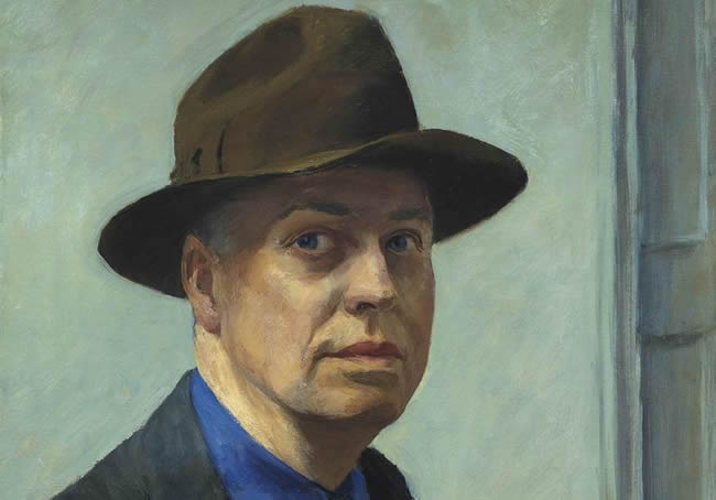 Solemn-faced Edward Hopper wearing a brown hat.