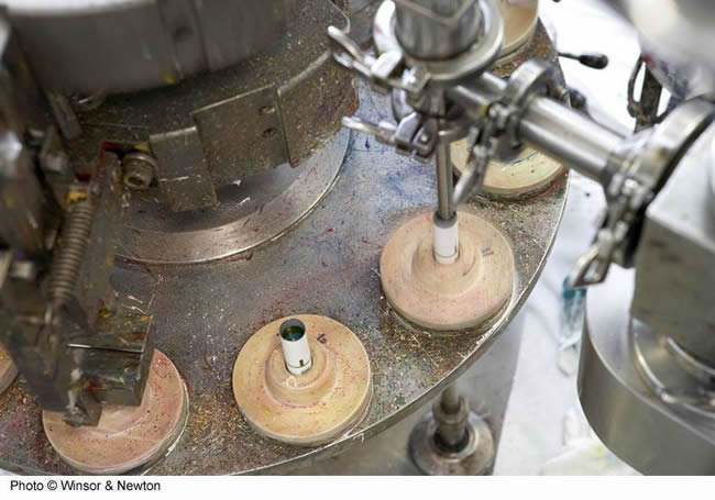 Paint tube filling machine on Winsor and Newton factory tour
