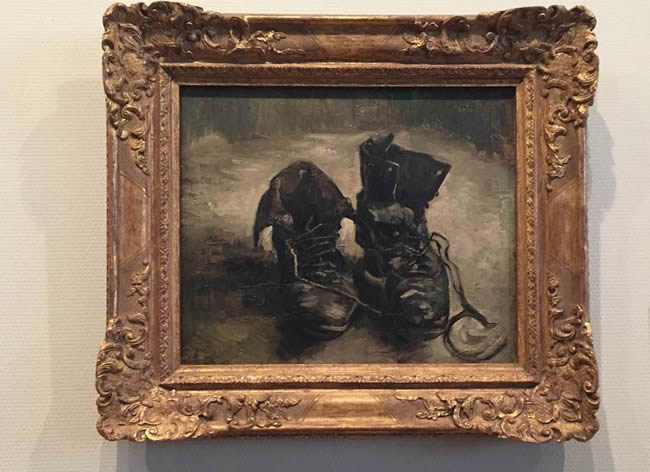 Painting of shoes in black and white by Vincent van Gogh