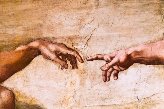 Close-up of God and Adam's hands