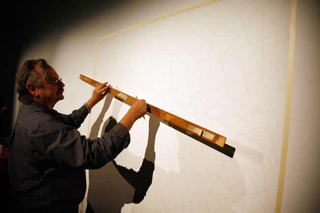 John Hogan creating a Sol Lewitt line drawing