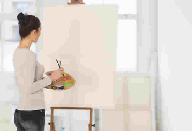 USA, New Jersey, Jersey City, Woman painting at easel