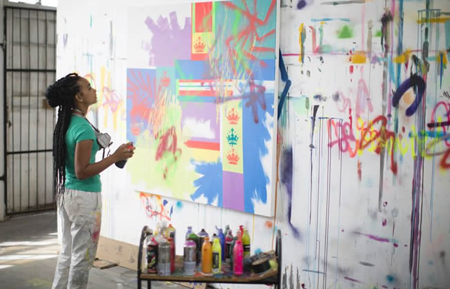 Young female artist working in her studio